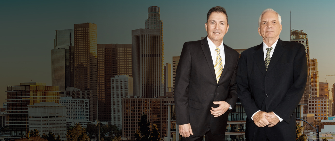 Picture of attorneys with the buildings of Encino, California, in the background