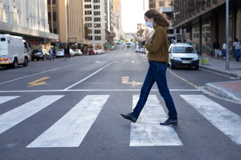 Photo of a Pedestrian Crossing the Street